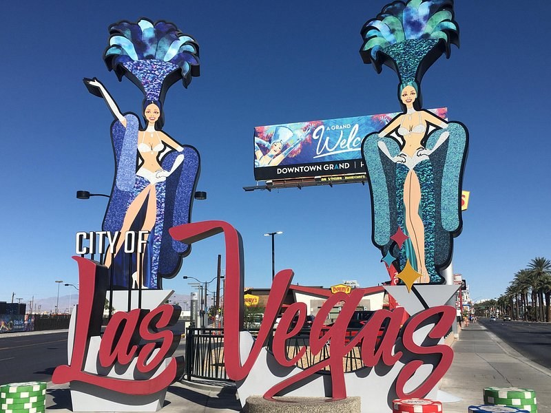 The neon showgirls and the City of Las Vegas script sign above Fremont Street in downtown Las Vegas